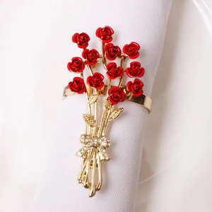 Romantic red rose napkin ring with golden alloy base and sparkling rhinestone bow detail