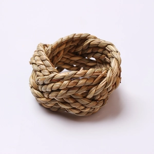 Handwoven natural corn husk napkin rings set for rustic table decor in spiral braided design