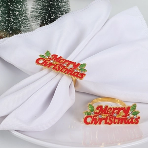 Golden Merry Christmas napkin rings with red letters and rhinestones for holiday dining