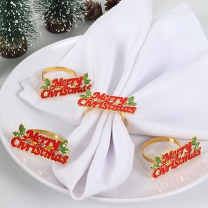 Set of 4 gold Merry Christmas napkin rings with red lettering and holly leaves decoration