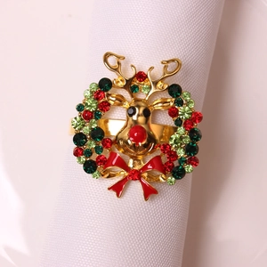 Macro shot of reindeer napkin ring with colorful rhinestones and gold alloy deer head