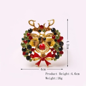 Golden Christmas reindeer napkin ring with colorful rhinestones and red bow detail
