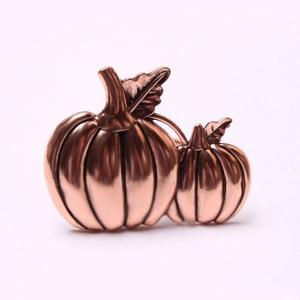 Detailed view of bronze pumpkin napkin rings with realistic texture for table decor