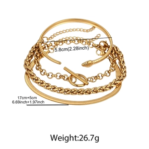 Detail of four-piece gold stainless steel set with snake head bangle and OT clasp chains