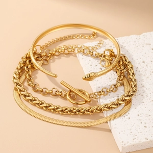 Detailed view of a 4-piece gold jewelry set featuring an OT buckle and snake chain