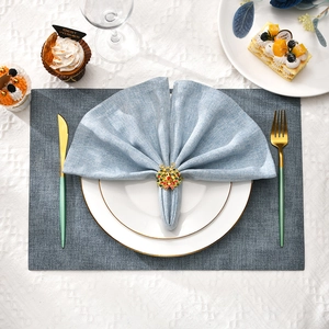 Christmas reindeer napkin ring with colorful crystals on a festive holiday table setting
