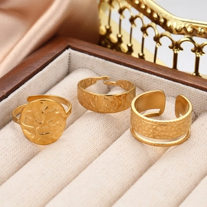 Three-piece gold stainless steel rings set with hammered texture and open adjustable design