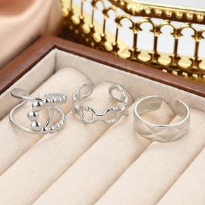 Three-piece silver stainless steel open ring set with beaded and textured link designs
