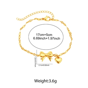 Detailed view of golden bow and heart pendant bracelet with specific size measurements