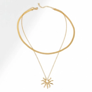 Double-layered gold stainless steel necklace featuring a flat snake chain and sun pendant