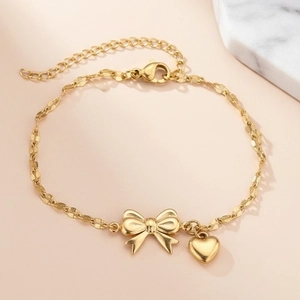 Golden stainless steel bow and heart pendant bracelet with adjustable twisted chain link