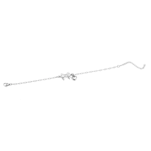 Detailed view of silver bow and heart pendant bracelet with adjustable extender chain