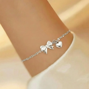 Silver bow and heart pendant bracelet made of polished stainless steel for women