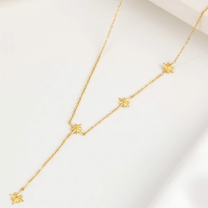 Golden stainless steel Y-shaped tassel necklace with four elegant eight-pointed star charms