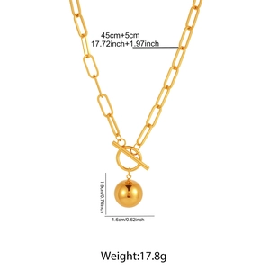 Detailed specs of golden paperclip chain necklace with toggle clasp and ball pendant