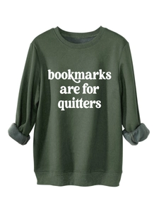 Detail view of the gray fleece lining inside the dark green thick crewneck sweatshirt