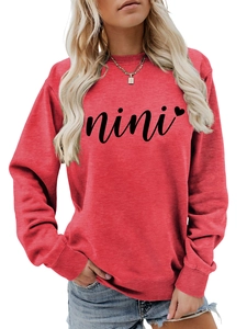 Close-up of red crewneck sweatshirt with black nini script and heart print detail
