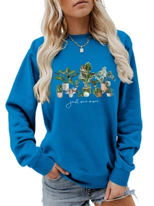 Detail of bright blue crewneck sweatshirt featuring a green plant pot illustration