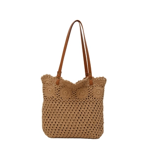 Hollow out cotton rope woven tote bag with brown leather straps for summer beach vacations