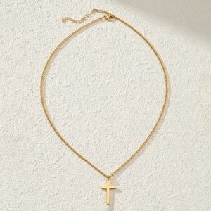 Minimalist gold cross pendant necklace with polished mirror finish and delicate cable chain