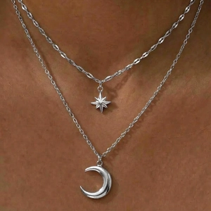 Double-layered stainless steel necklace featuring star and moon pendants for women