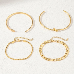 Set of 4 gold minimalist stainless steel bracelets including snake and knot bangles