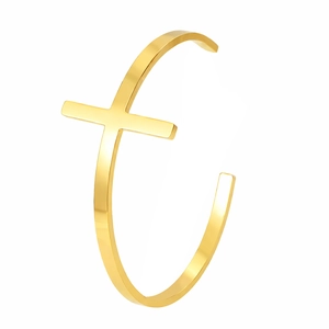Detail shot of the polished 18K gold-plated cross element on this slim cuff bracelet