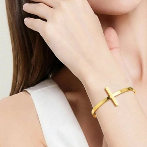 Minimalist 18K gold plated stainless steel open cuff bracelet with cross design on wrist