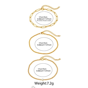 Detailed view of three-piece gold paperclip and curb link chain set with zircon stone