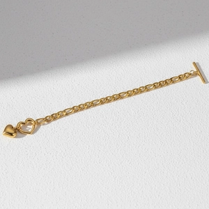 Golden Figaro chain bracelet with solid heart pendant and classic OT toggle clasp design