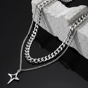 Double-layered silver necklace with thick Cuban chain and hollow star pendant on stone