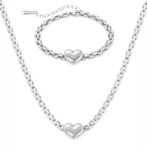 Macro shot of silver heart pendant and S.STEEL engraved tag on the jewelry set