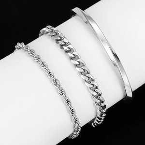 Three-piece stainless steel silver Cuban chain and twisted cuff bracelet set on stand
