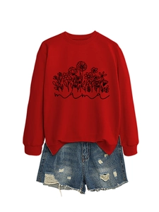 Detail of red floral sweatshirt with mama lettering and blue ripped denim shorts