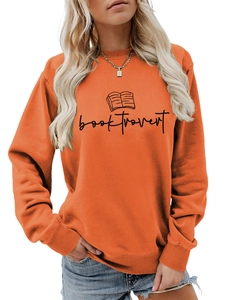 Detail of the orange crewneck sweatshirt featuring a black Booktrovert text and book graphic