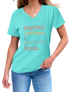 Close-up of V-neck teal T-shirt featuring capital letters and periods artistic print