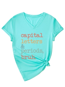 Detail of mint green V-neck T-shirt with rolled sleeves and stylish knotted hem