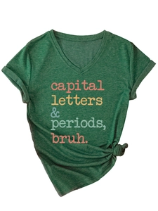 Detail of V-neck dark green T-shirt featuring retro text print and front knot hem design
