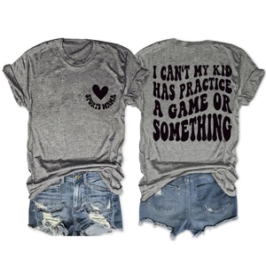 Detail of grey Sports Mama T-shirt with back slogan and distressed denim shorts