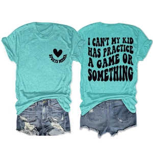Detail of tiffany blue cotton t-shirt with heart print and distressed denim shorts set