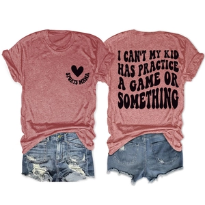Flat lay of pink Sports Mama t-shirt with back slogan and ripped denim shorts