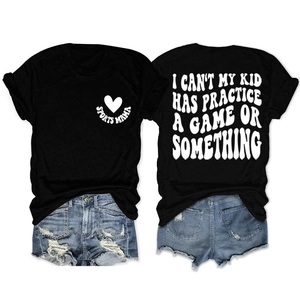 Flat lay of Sports Mama T-shirt and distressed denim shorts showing front and back