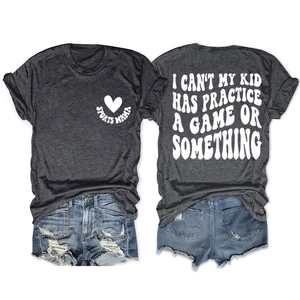 Detail of grey short sleeve T-shirt with Sports Mama print and distressed denim shorts