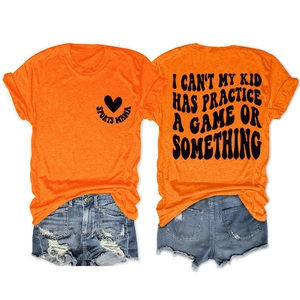 Detail view of cotton t-shirt with 'I CAN'T MY KID HAS PRACTICE' print and denim shorts
