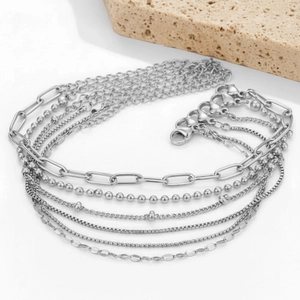 Elegant 6-piece silver stackable chain bracelet set including paperclip and Cuban links