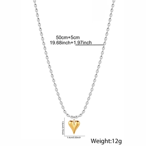 Detail of silver bead chain and gold heart pendant with dimensions 1.8x1.4cm and 50+5cm length