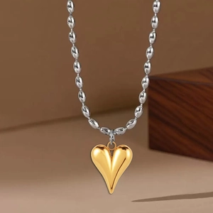 Two-tone stainless steel rice bead chain necklace with polished gold heart pendant