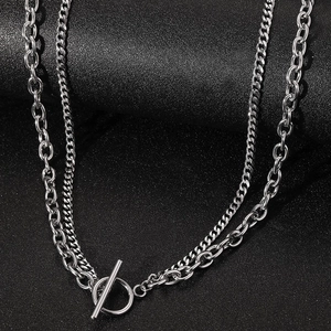 Double layered OT buckle necklace featuring chunky curb chains in polished steel