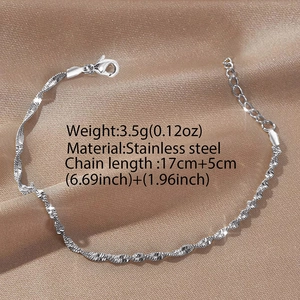 Silver stainless steel water wave twist chain bracelet with lobster clasp on silk fabric