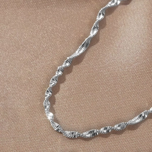 Elegant 18K gold-plated stainless steel water wave chain bracelet for women on satin